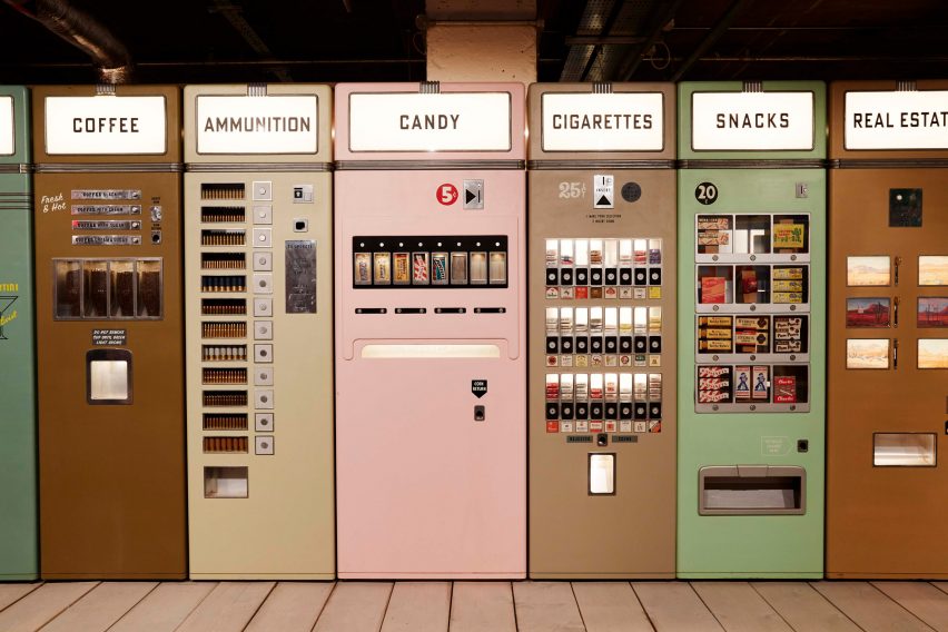 A series of colourful vending machines on wooden decking