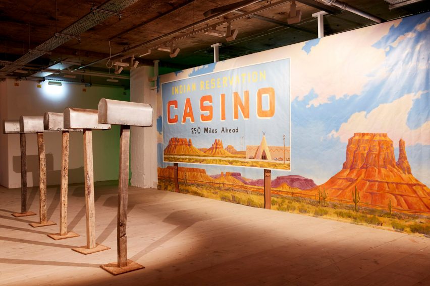 Large billboard poster and mailboxes at the Asteroid City exhibition