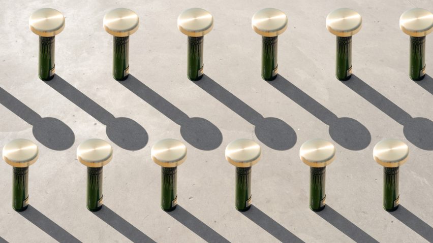 Rows of green lamps made from shell casings