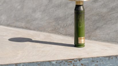 Green lamp made from shell casings
