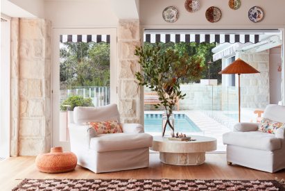 Seating area next to pool in Sydney house by YSG