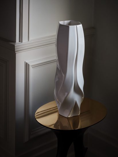 Photograph showing sculptural vase on coffee table