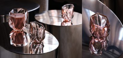 Photograph showing coloured glassware on coffee table