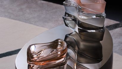 Photograph showing coloured glassware on coffee table