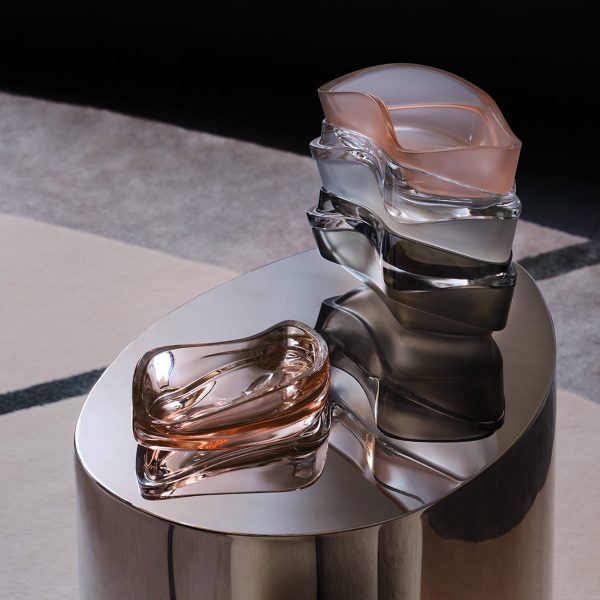 Photograph showing coloured glassware on coffee table
