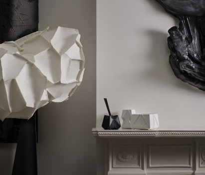 Photograph showing mantlepiece with diffuser and candle on it