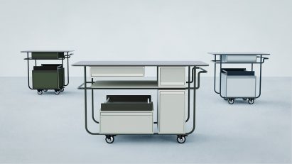 Three trolleys on plain backdrop