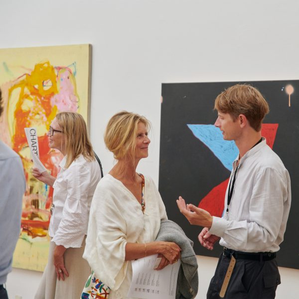 Photo of people in a gallery at Chart Art Fair