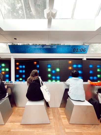 Visitors interacting with the exhibition