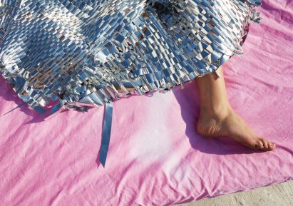 Someone's foot sticking out of a bed