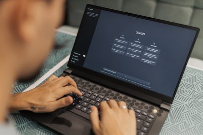Photo of person using ChatGPT on their laptop