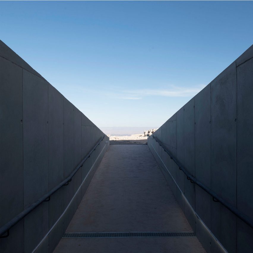 An underground entrance and walkway made of concrete