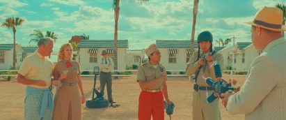 Actors in a desert-like scene in Wes Anderson's Asteroid City