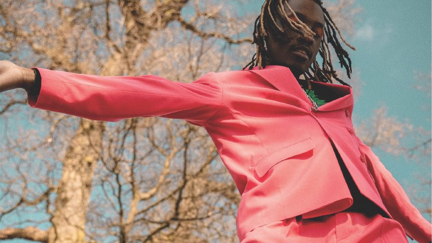 Man dancing in a pink suit
