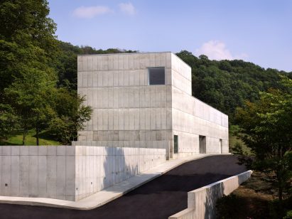 Concrete building with vertical protrusion and square windows