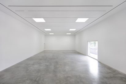 Polished concrete floors and white ceilings