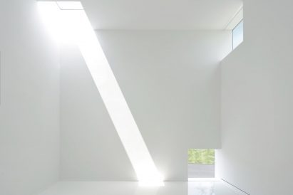White room with beams of sunlight