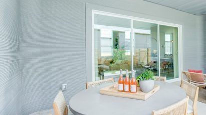 3D-printed walls and patio area of BIG house Texas