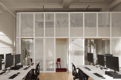 Steel mesh mezzanine within historic bank building