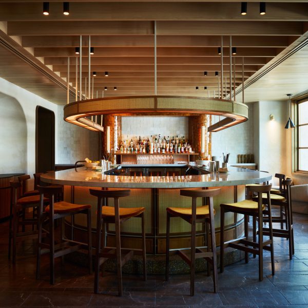 U-shaped bar and suspended light fixture wrapped in rattan