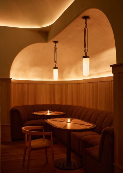 Booth set in a niche carved from the walls