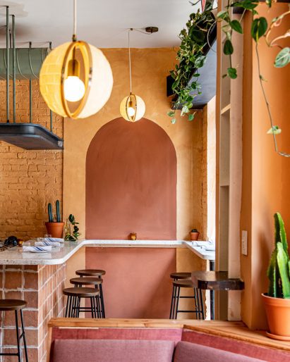 Bar area with earth-toned plaster walls