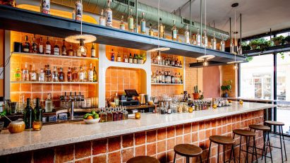 Bar with mycelium pendant lights suspended above in Donna restaurant
