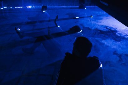 People playing in blue fog at Jerusalem Design Week