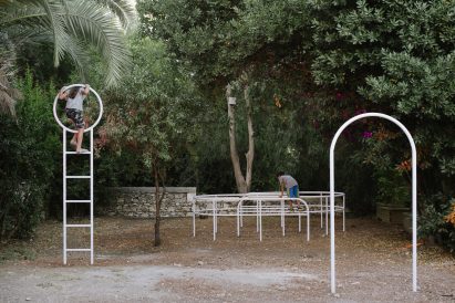 White metal play sculptures in a garden