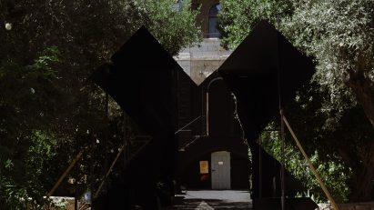 Black X installation in front of Hansen House at Jerusalem Design Week
