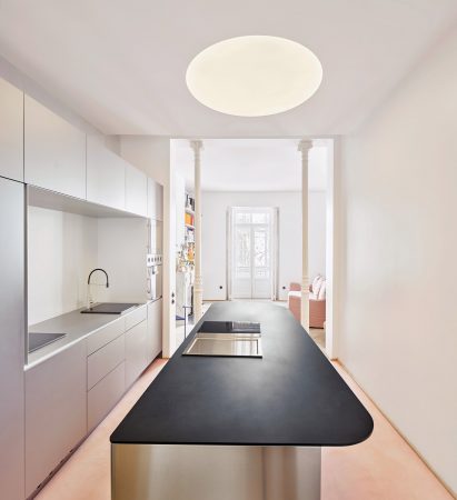 Kitchen with chrome counter in JJ16 apartment by Lucas y Hernández-Gil