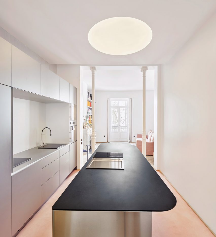 Kitchen with chrome counter in JJ16 apartment by Lucas y Hernández-Gil