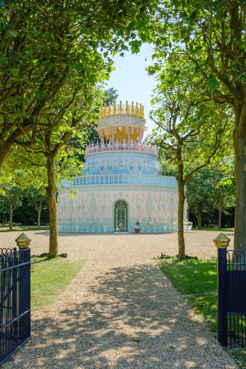 The pavilion is at the end of a grove of trees