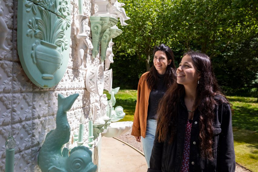 Visitors admire the sculptural tiles