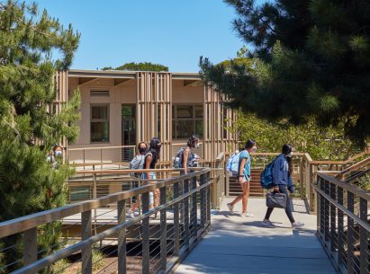Elevated walkway with school in background