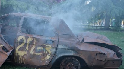 Maxim Velčovský has developed a light installation that comprises a car destroyed and burned during the war in Ukraine. Photo by Vojtěch Veškrna