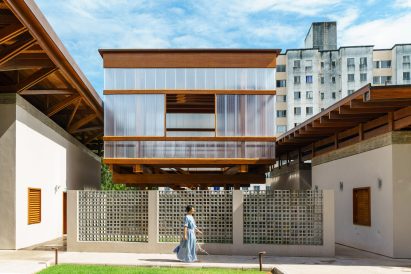 Polycarbonate-wrapped library with wooden accents