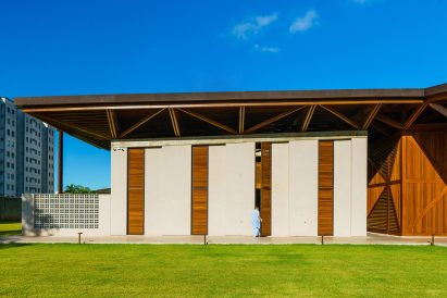 Monastery building with wooden accents by Mixtura