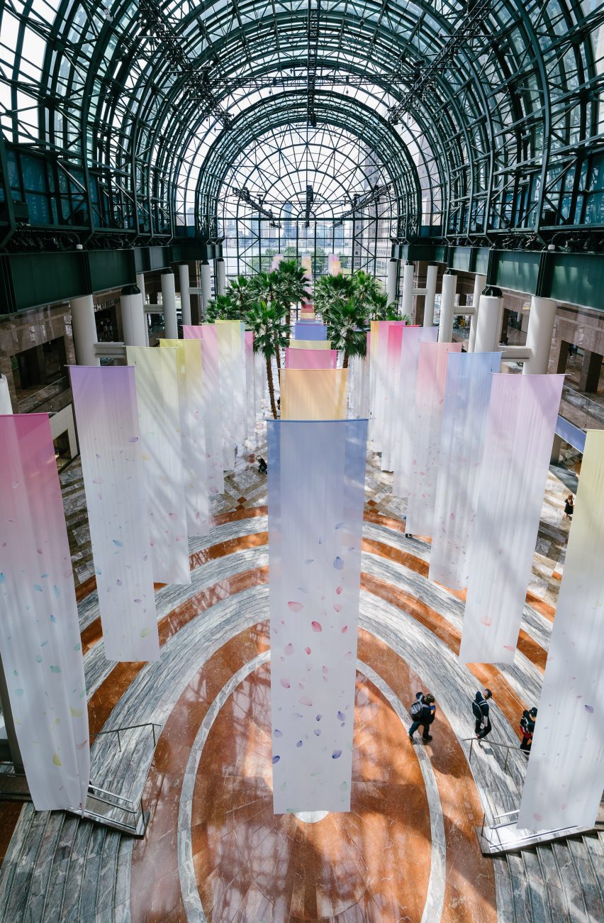 suspended colorful banners hanging in a glass atrium