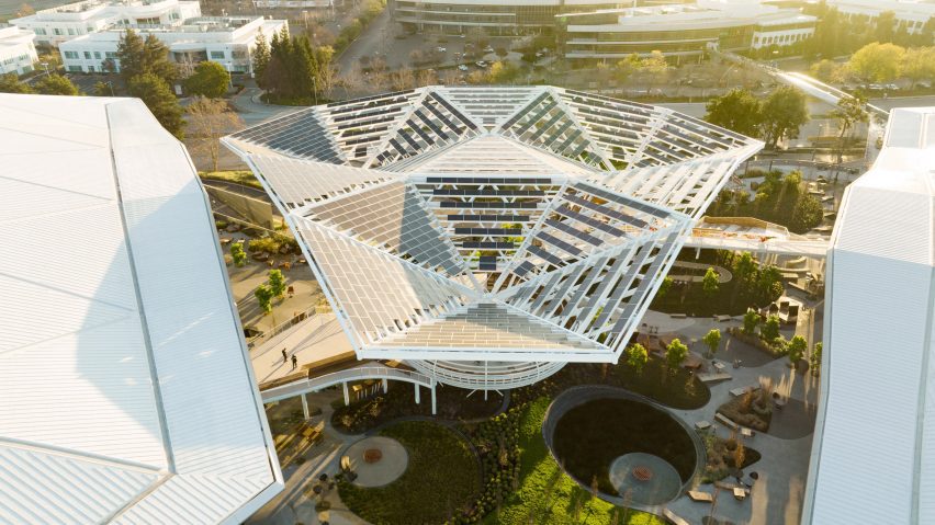 Large trellis between two buildings with solar panels