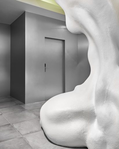 Metallic walls and concrete floors in Rains store