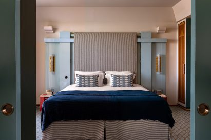 Bedroom with art deco influenced headboard