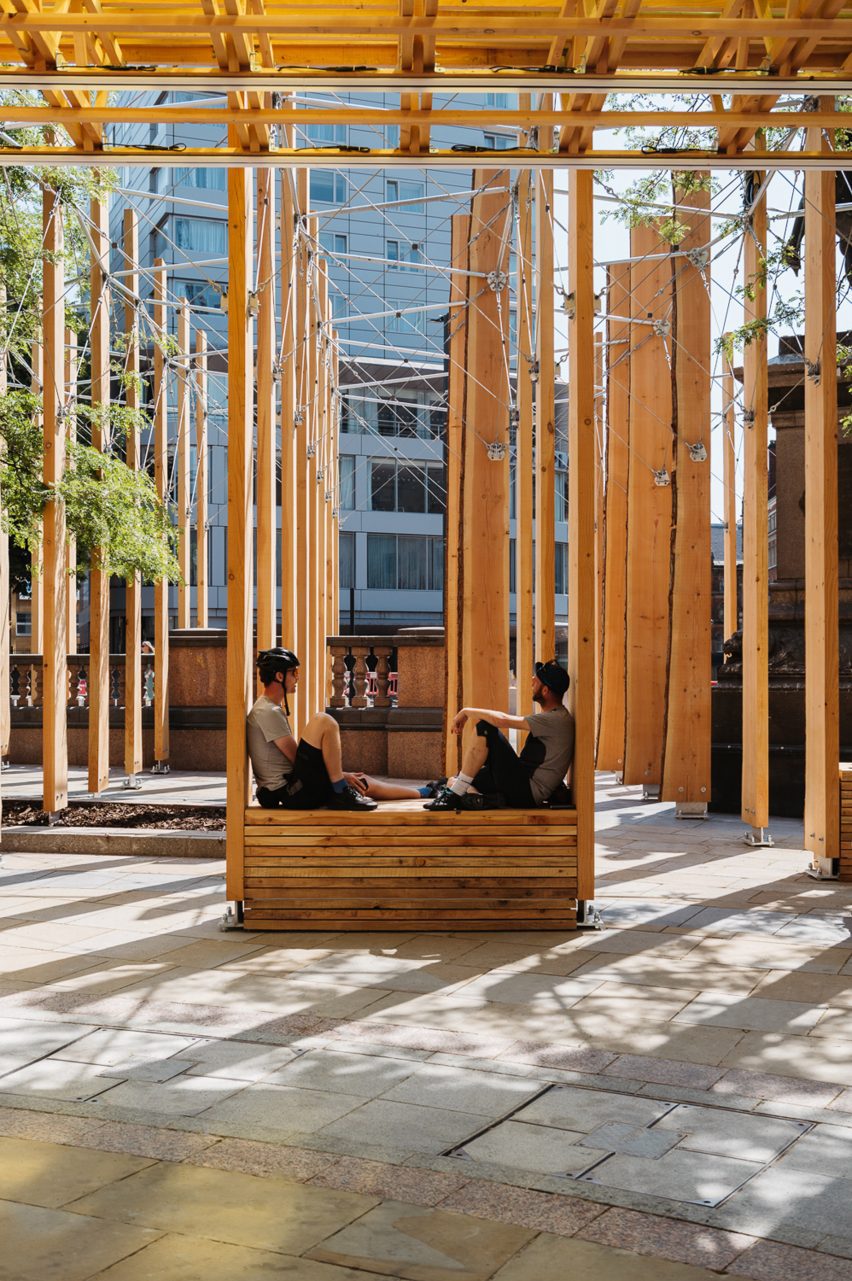 Two people sitting amidst Making A Stand installation in Leeds