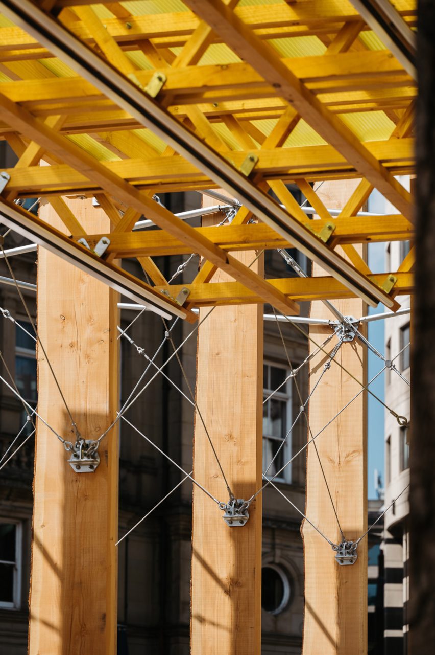 Close up of timber and steel rods that form the structure of Making A Stand installation