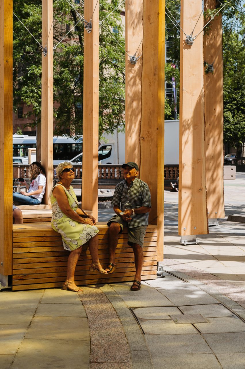 Two people sat on Studio Bark installation Leeds
