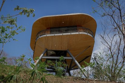 Guitar pick-shaped timber pod