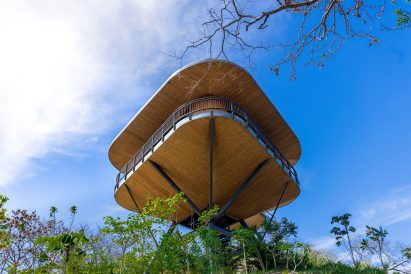 Angled view of a curved timber pod