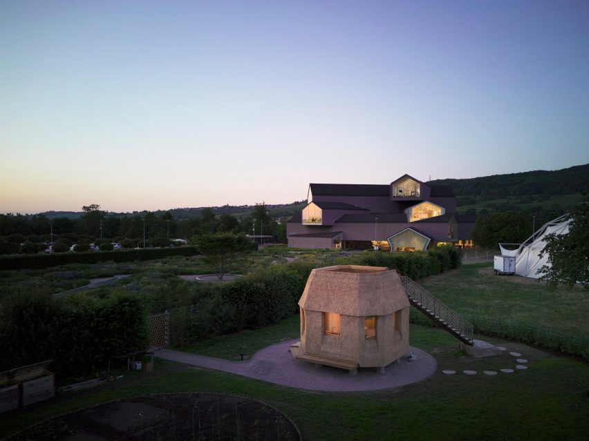 Thatch house on stone by Tsuyoshi Tane