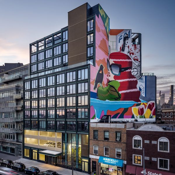 Photograph of a mural and terracotta facade