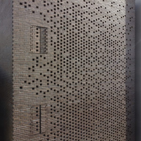 Perforated brick facade